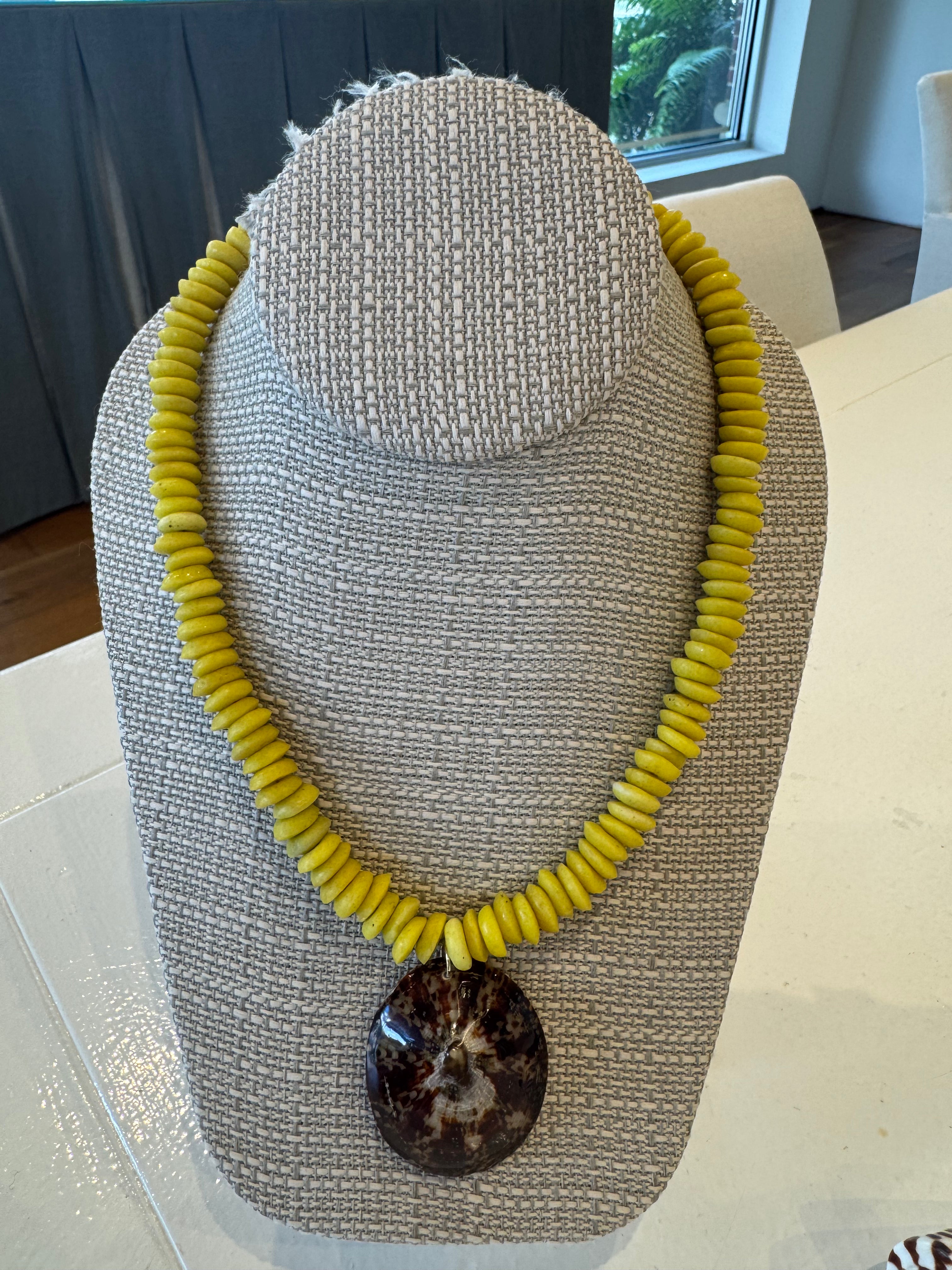 Bright Yellow Beads with Limpet Shell