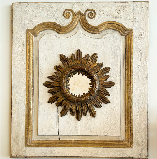 Antique Sunburst Mirror on Wooden Panel
