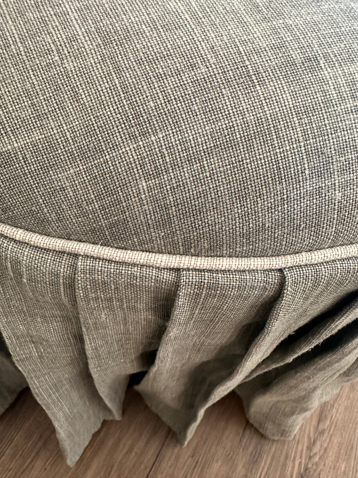 Pleated Ottoman in Gray Fabric with Silver Piping Detail